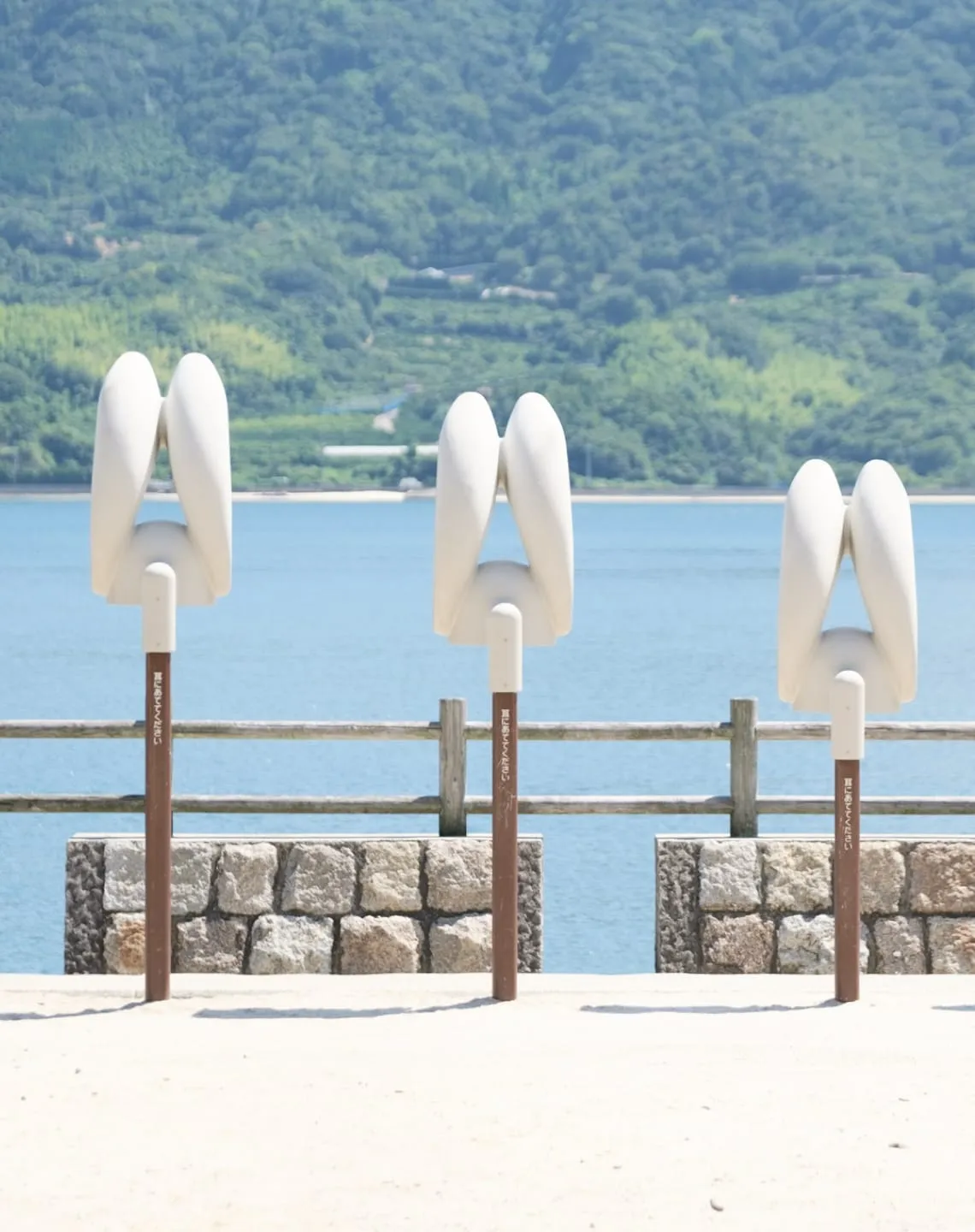 A close-up of a wild rabbit looking directly into the camera lens.